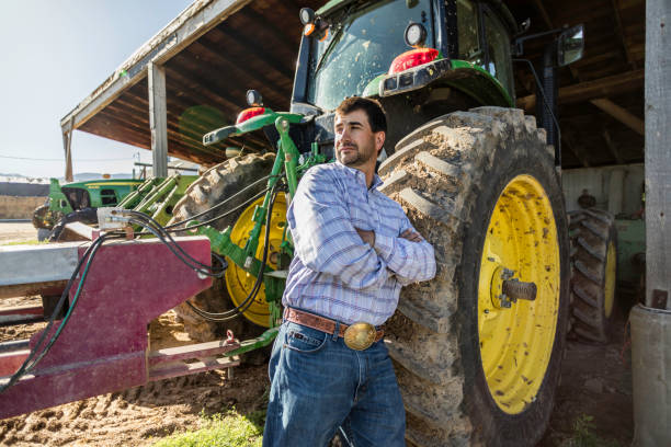 Farmer with Tractor on a Ranch stock photo