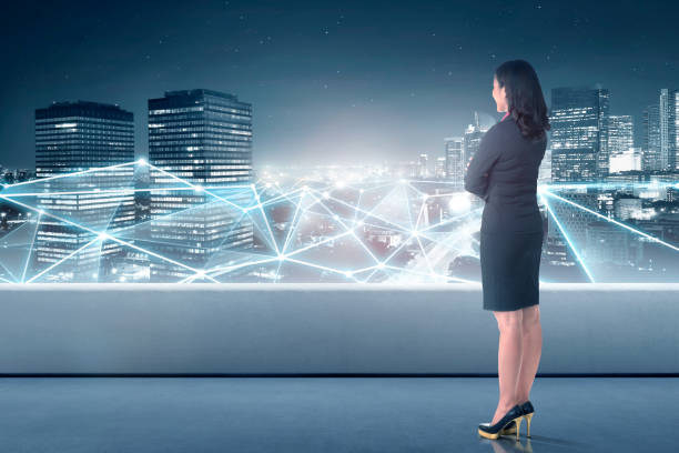 istock Beautiful asian business woman looking at network connection 1006294662