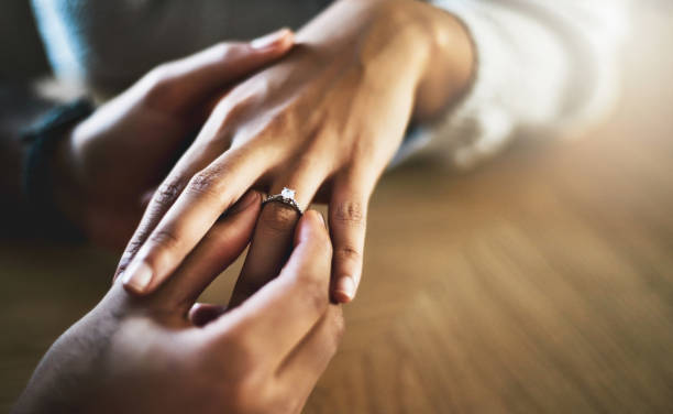 Will you make me the happiest man and marry me? Cropped shot of a man putting an engagement ring onto his girlfriend's finger jewelry photos stock pictures, royalty-free photos & images
