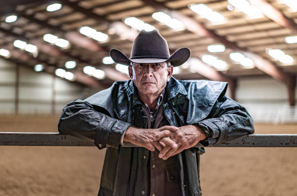 istock Cowboy at a horse stable 1006297794