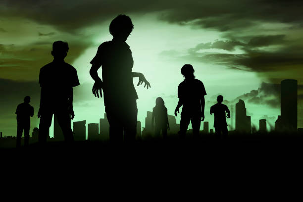 istock Silhoutte of zombies walking 1006303172