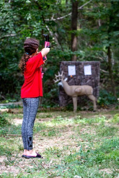 istock Young Girl Practicing Deer Hunting Skills 1006344188