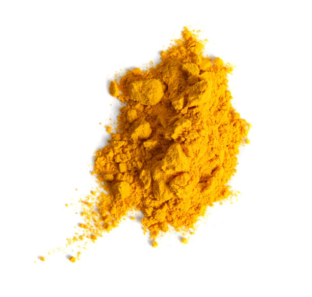 istock Turmeric (Curcuma) powder pile isolated on white background, top view. 1006355428