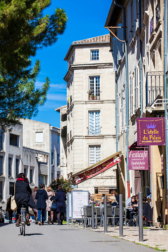 AVIGNON, FRANCE - MARCH, 2018: Street of the Avignon old city in winter