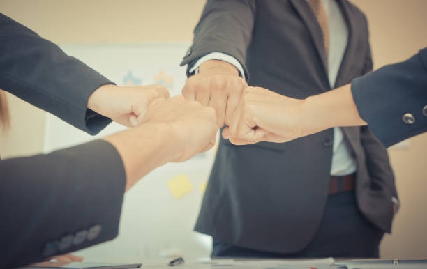istock Four hand together in business meeting for team concept 1006360780