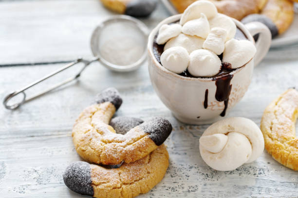 istock Cup with hot chocolate and almond cookies. 1006373432