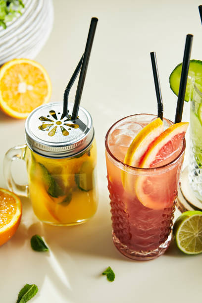 istock Mango, Grapefruit, Cucumber and Lime Lemonade with Mint Leaves in Glasses Close Up 1006373638