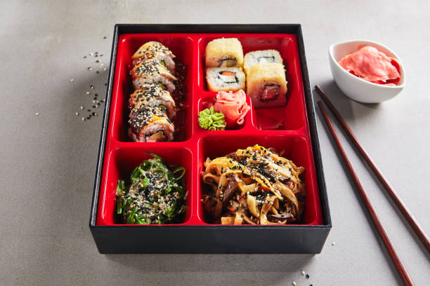 istock Fresh Food Portion in Japanese Bento Box with Sushi Rolls 1006373732
