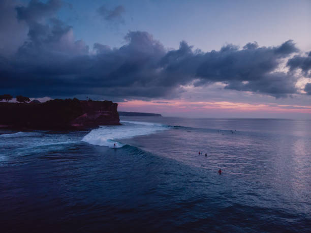 istock Aerial shote with sunset or sunrise at ocean with waves 1006373786