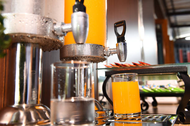 istock Orange juice and water in water cooler 1006383974