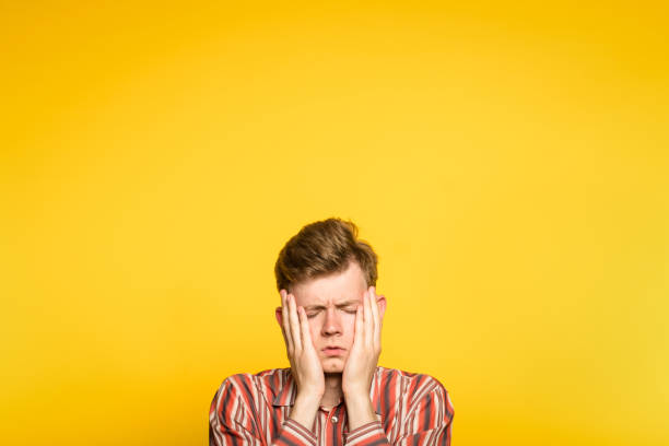 istock sad depressed cheerless man covering face hand 1006383998