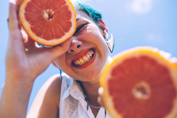 istock Girl loves grapefruit 1006384220