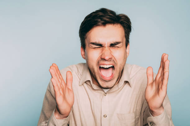 istock man screaming feelings overload fury emotion 1006386538