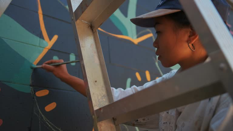 Mural artist at work