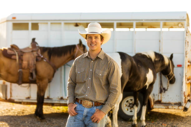 High quality stock photo of an cowboy rancher looking away at dusk