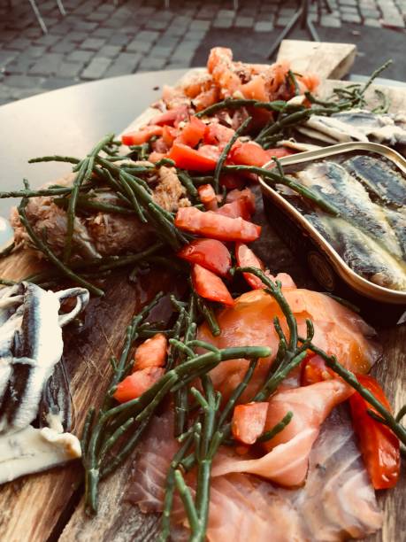 istock Seafood tapas snack sharing plank salmon anchovy tuna crab 1006414892