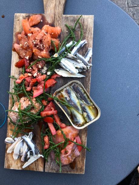 istock Seafood tapas snack sharing plank salmon anchovy tuna crab 1006414972