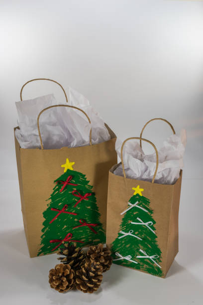 istock Paper gift bags painted with Christmas design 1006423800