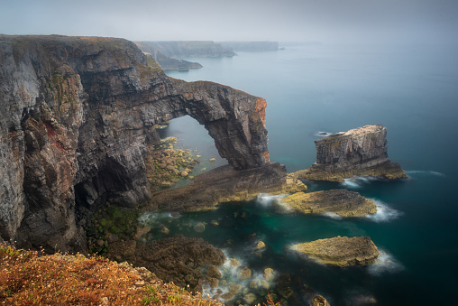 The Green Bridge of Wales, a natural limestone arch formed off the Pembrokeshire coast