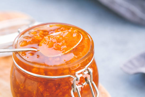 istock Glass jar with cloudberry jam. Nordic cuisine. 1006442744