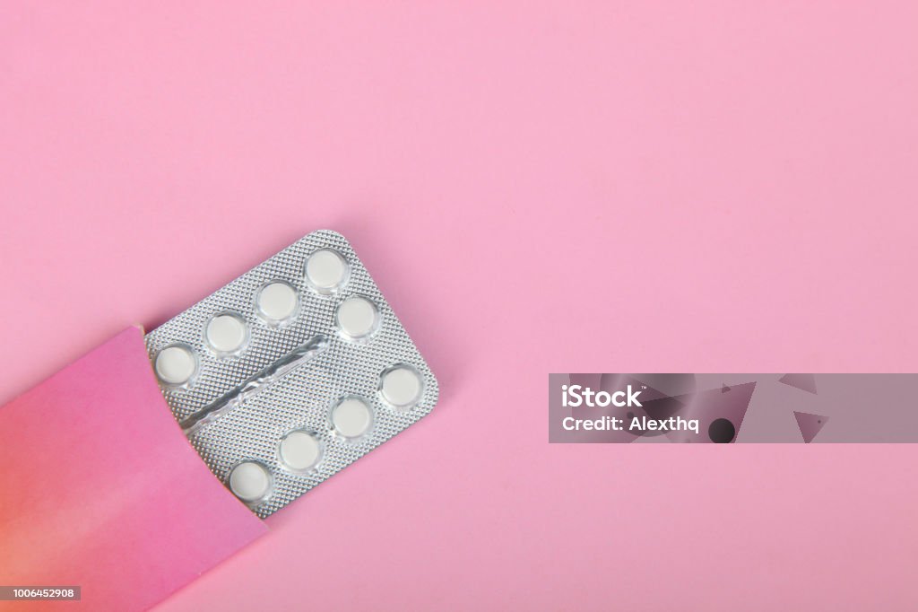 Contraceptive pills Contraceptive pills in the package on a pink background. Birth Control Pill Stock Photo