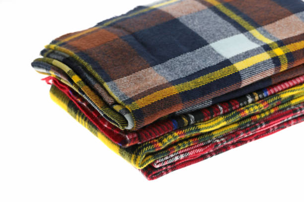 istock Scarf. checkered warm scarves pile isolated on white background. 1006463200