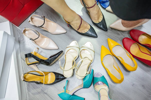 istock Women trying high heels next to one another 1006480782