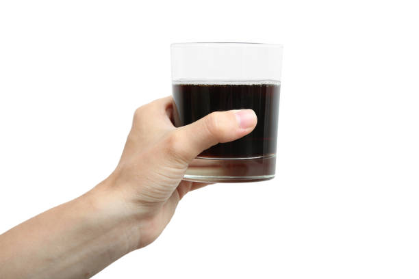 istock glass with a drink in the left hand 1006481872