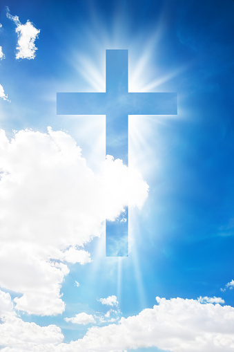 Cross shape shining in cloud blue sky. Christian conceptual image background