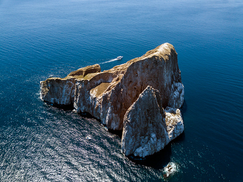 Aerial view of the famous Kicker Rock (Leon Dormido) at the north western coast of San Cristobal Island, Galapagos, Ecuador. Kicker Rock is one of the most visited touristic places and one of the best spots for snorkeling and scuba diving on the Galapagos Islands.