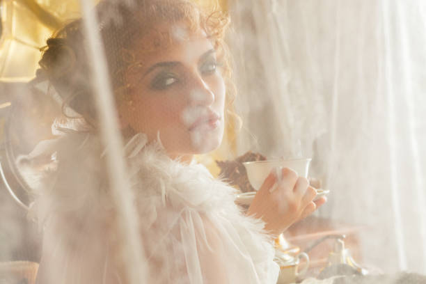 istock Young retro woman drinking tea or coffee in the morning 1006489628