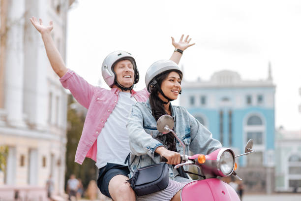 istock Happy optimistic couple going on motorbike 1006496912