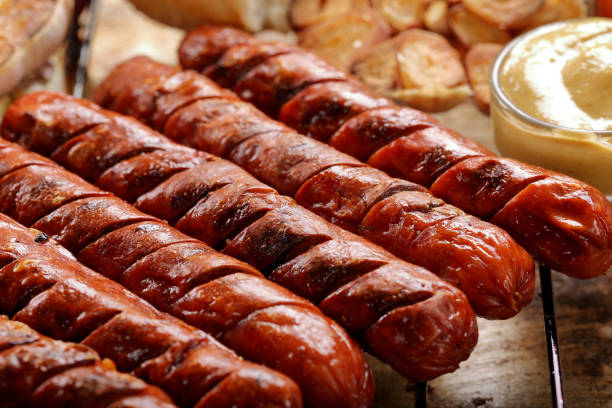 istock Grilled sausages in oven pan with garlic and onion 1006497000
