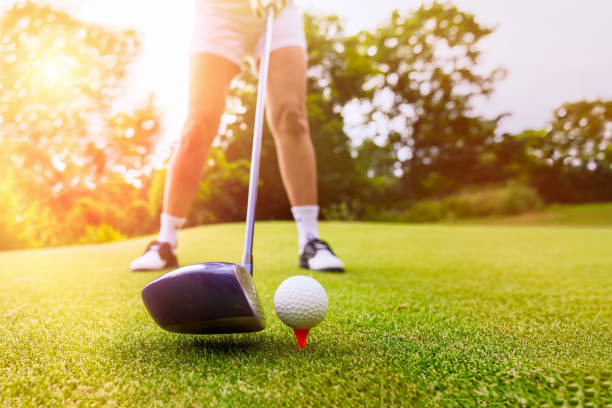 istock Golfer focus putting golf ball into the hole. 1006499626