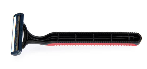 istock Red disposable shaving razor isolated on white background. 1006500188