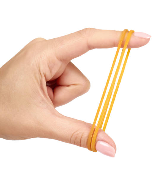 pasos fantasma Último Yellow Rubber Bands Close Up With Hand Isolated On White Background Stock  Photo - Download Image Now - iStock