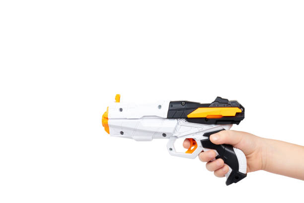 istock Futuristic toy gun with kid hand, isolated on white background. copy space template 1006503582