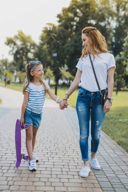 istock Active mother and daughter spending time in the park 1006524978