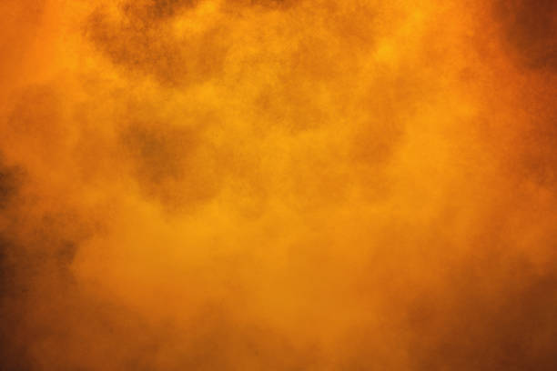 istock Explosion of orange powder. 1006525184