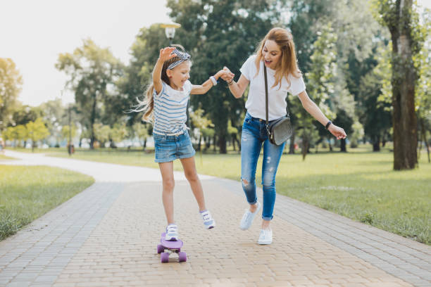 istock Preschool girl feeling funny and free while using her skateboard 1006525978