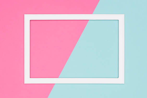 istock Abstract geometrical pastel blue and pink colored paper flat lay background. Minimalism template with empty picture frame mock up. 1006528464