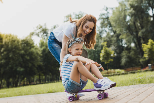 istock Young loving mother watching her active girl 1006529048