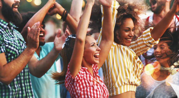istock Friends dancing at a concert. 1006529680