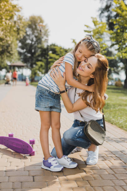 istock Smiling mother feeling relieved after realizing her girl is fine 1006532064