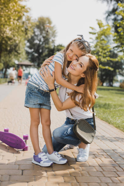 istock Caring young mother hugging her little girl 1006534192