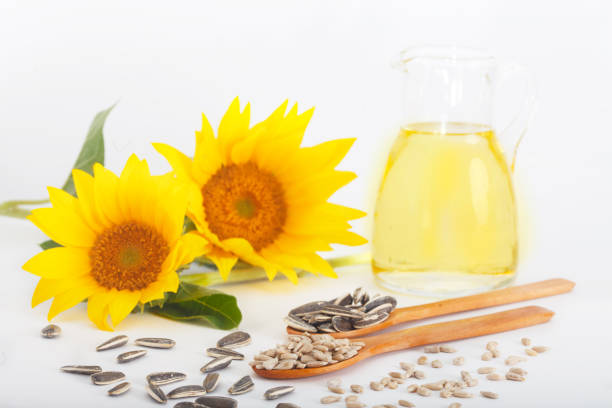 istock Freshly squeezed sunflower oil in a glass jug 1006538604