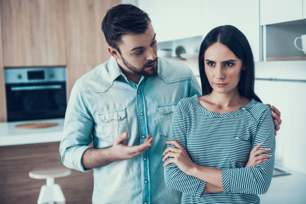 istock Young Couple Have Disagreement in Kitchen at Home. 1006542782