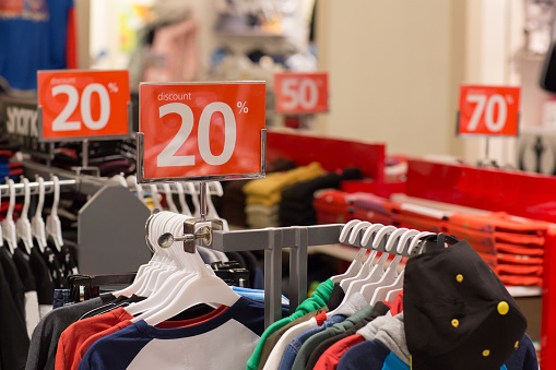 Shopping Sale Seasonal Discount On Clothes In Apparel Shop Store Or Mall  Stock Photo - Download Image Now - iStock