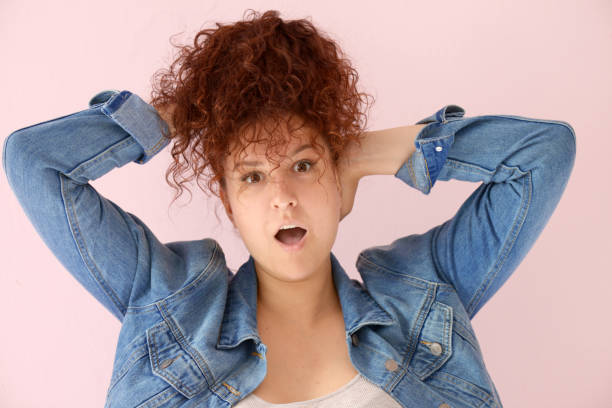 istock Beautiful girl on the pink background 1006546274