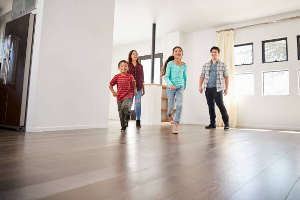 istock Excited Family Exploring New Home On Moving Day 1006546686